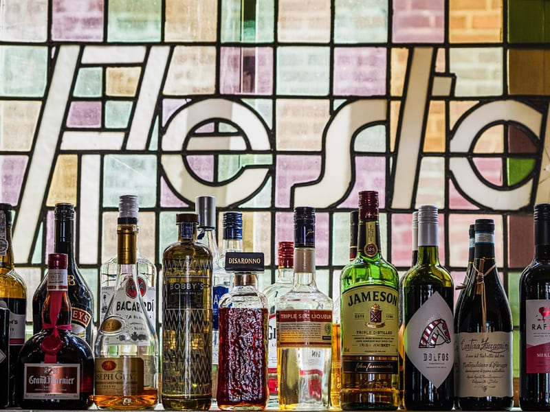 Bottles in front of the leaded glass window in Amsterdam