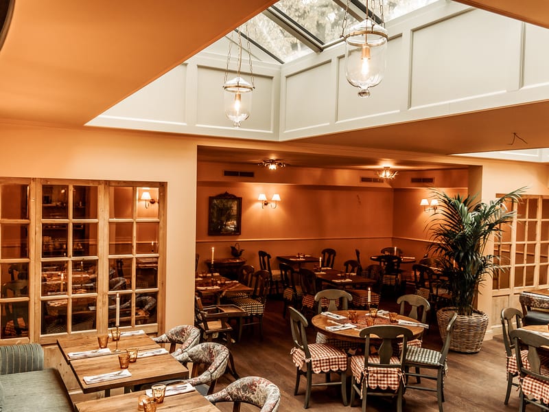 The light room under the skylight with wicker chairs