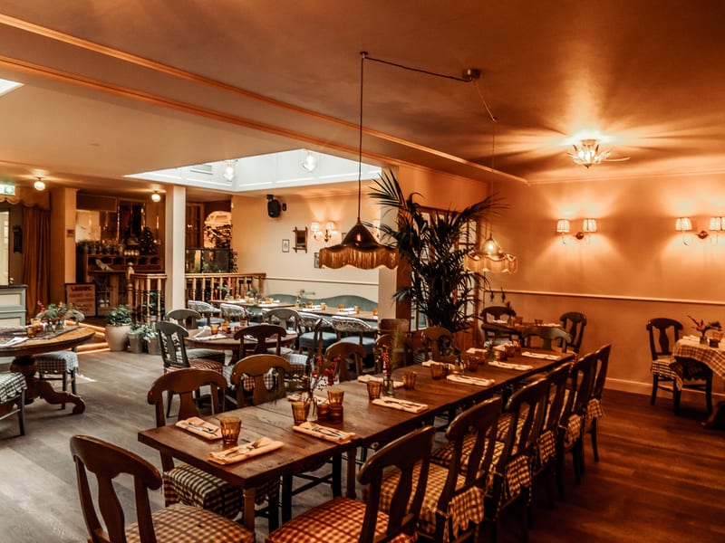 The long table for groups in the main room